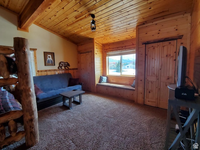 5085 Trumpeter, Island Park, ID 83429 - living area featuring lofted ceiling with beams, carpet, wood walls, and wooden ceiling