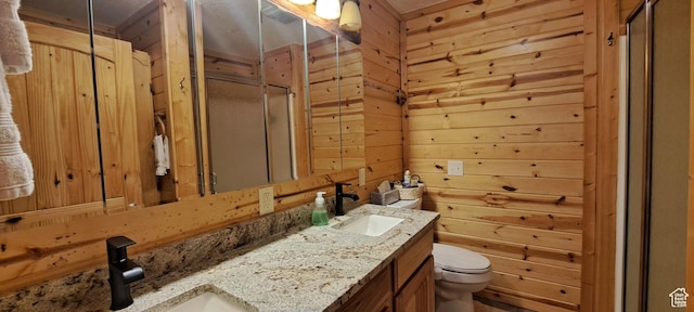 5085 Trumpeter, Island Park, ID 83429 - full bathroom with wood walls, toilet, a shower stall, and a sink