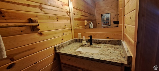 5085 Trumpeter, Island Park, ID 83429 - bathroom featuring vanity and wooden walls