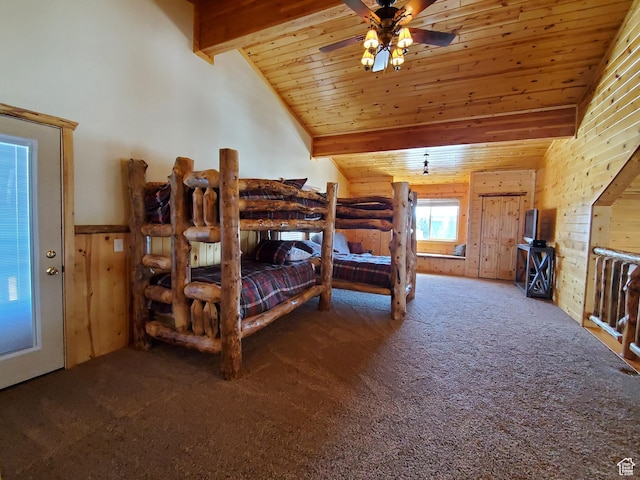 5085 Trumpeter, Island Park, ID 83429 - bedroom featuring carpet flooring, wood walls, wooden ceiling, and vaulted ceiling with beams