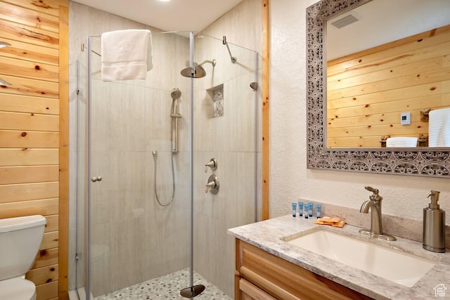 5085 Trumpeter, Island Park, ID 83429 - bathroom featuring visible vents, a stall shower, toilet, and vanity