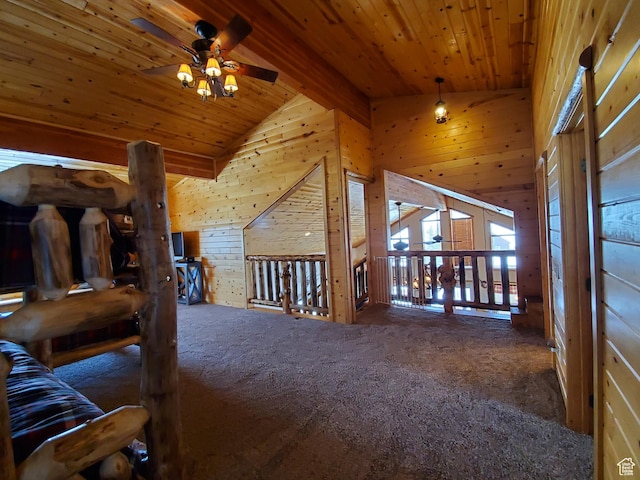 5085 Trumpeter, Island Park, ID 83429 - interior space with wooden walls, high vaulted ceiling, ceiling fan, wooden ceiling, and carpet flooring