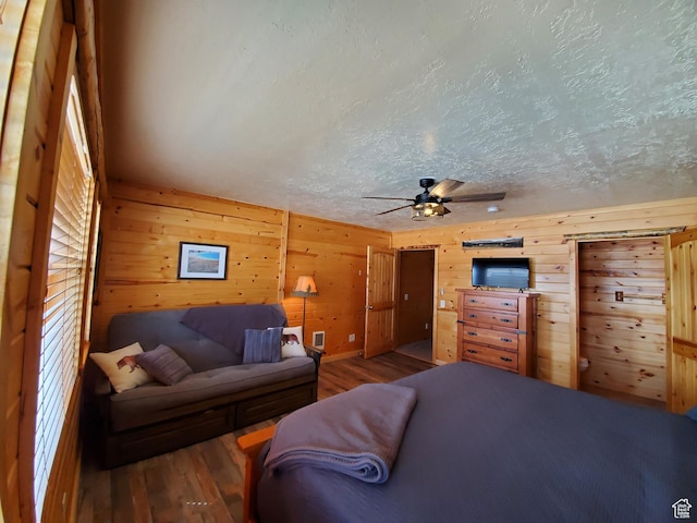 5085 Trumpeter, Island Park, ID 83429 - living area with a textured ceiling, wood finished floors, and wooden walls