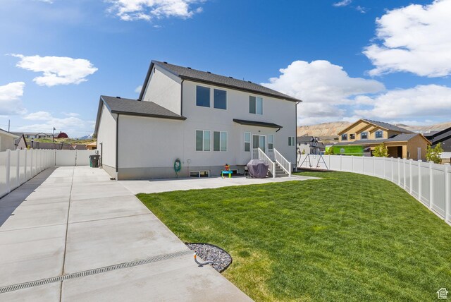 7382 W Butter Hollow Cir, Herriman, UT 84096 - back of house featuring a patio and stucco siding