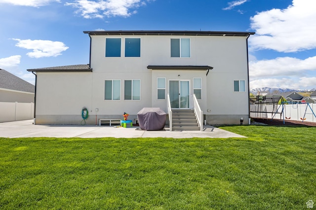 7382 W Butter Hollow Cir, Herriman, UT 84096 - rear view of house featuring entry steps, a patio, and stucco siding