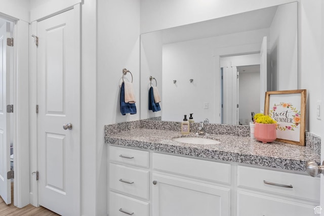 7382 W Butter Hollow Cir, Herriman, UT 84096 - bathroom with vanity and wood finished floors