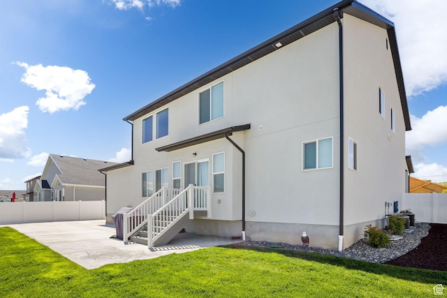 7382 W Butter Hollow Cir, Herriman, UT 84096 - rear view of house featuring a patio area and stucco siding