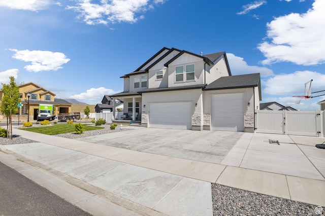 7382 W Butter Hollow Cir, Herriman, UT 84096 - view of front facade featuring a gate, stone siding, stucco siding, and fence