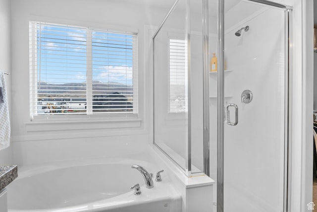 7382 W Butter Hollow Cir, Herriman, UT 84096 - full bathroom featuring a stall shower, a bath, and healthy amount of natural light