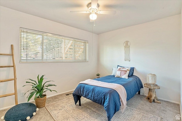 bedroom with visible vents, a ceiling fan, baseboards, and carpet floors