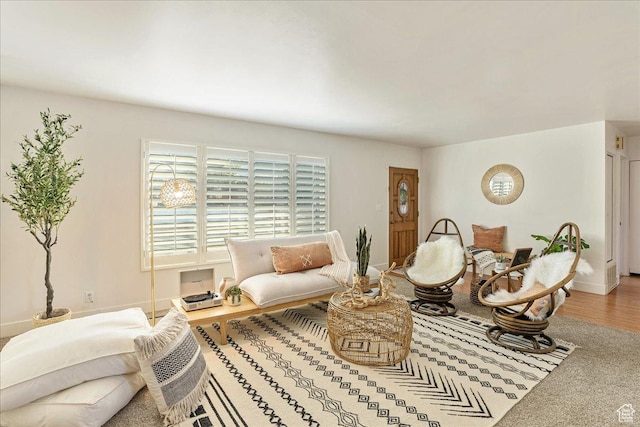 living room featuring baseboards and wood finished floors