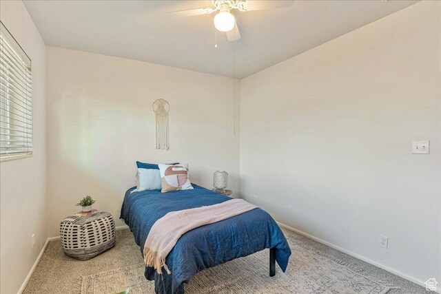 bedroom featuring a ceiling fan, baseboards, and carpet floors