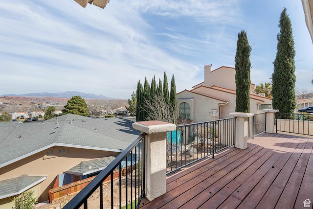 wooden deck featuring a mountain view