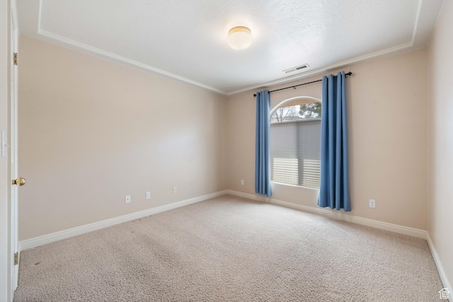 empty room featuring visible vents, a textured ceiling, baseboards, and carpet