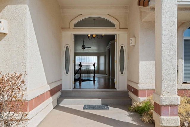 property entrance with stucco siding