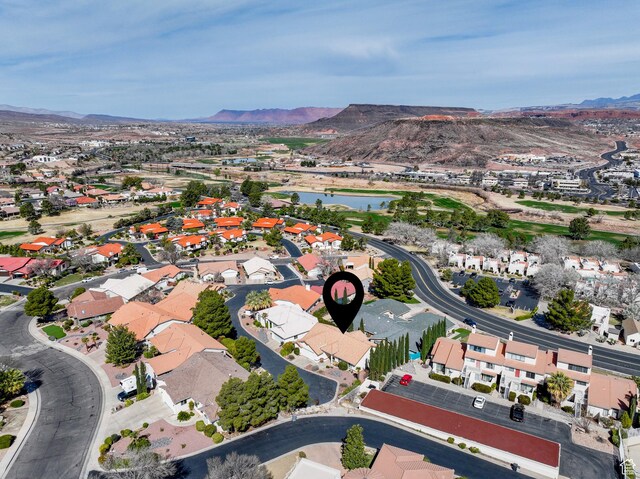 birds eye view of property featuring a residential view and a water and mountain view