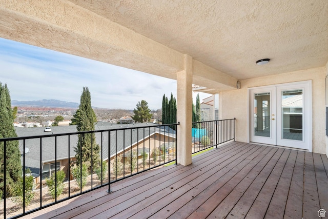 deck featuring french doors and a mountain view