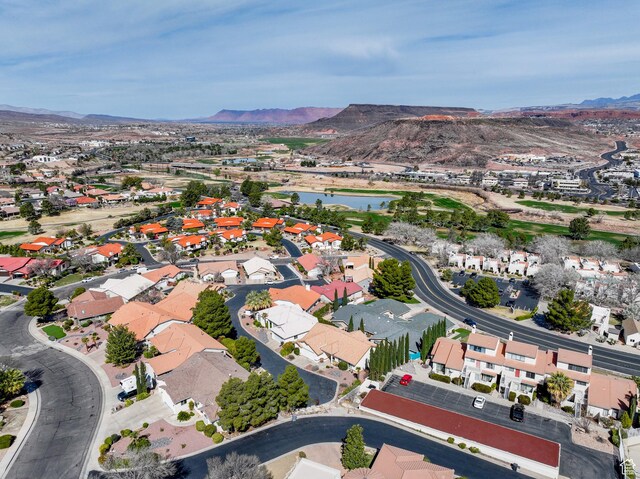 drone / aerial view with a residential view and a water and mountain view