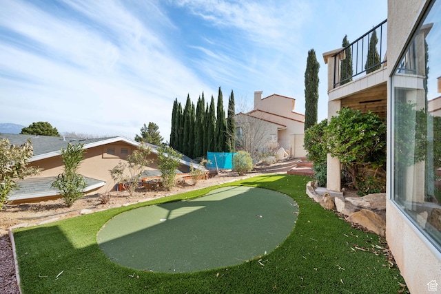 view of yard with a balcony