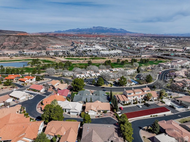 birds eye view of property featuring a residential view and a water and mountain view