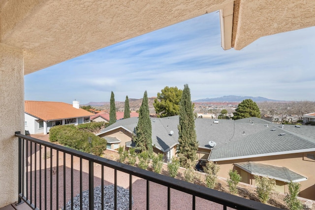 balcony with a mountain view and a residential view