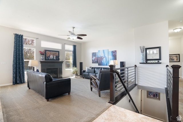 2581 W 2675 N, Farr West, UT 84404 - living area featuring baseboards, a ceiling fan, carpet flooring, and a glass covered fireplace