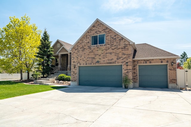 2581 W 2675 N, Farr West, UT 84404 - view of front of property with concrete driveway, a shingled roof, an attached garage, fence, and brick siding