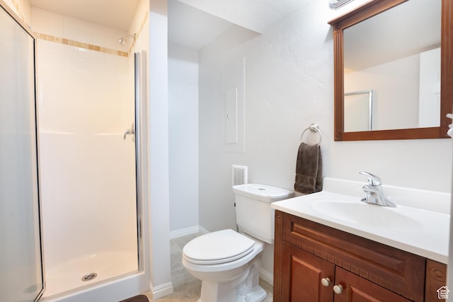 2581 W 2675 N, Farr West, UT 84404 - full bathroom featuring vanity, toilet, a stall shower, and baseboards