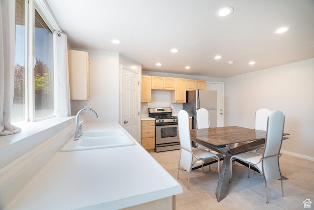 2581 W 2675 N, Farr West, UT 84404 - kitchen with recessed lighting, light brown cabinets, appliances with stainless steel finishes, light countertops, and a sink