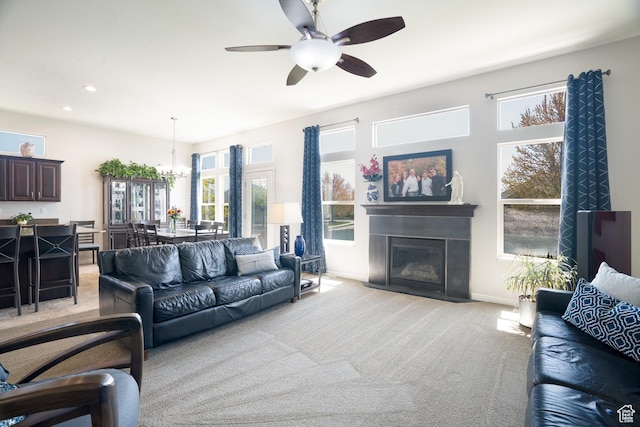 2581 W 2675 N, Farr West, UT 84404 - living area with recessed lighting, light colored carpet, ceiling fan with notable chandelier, baseboards, and a fireplace with flush hearth