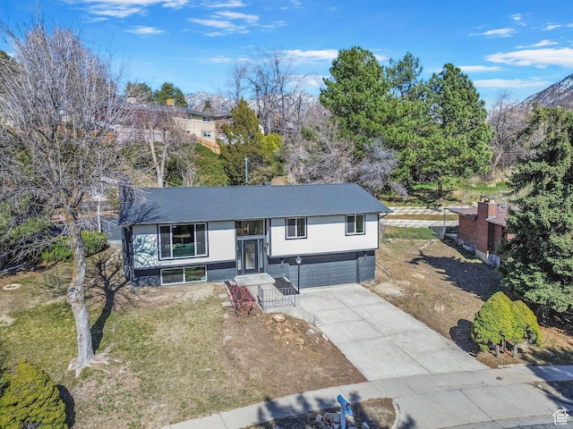 2605 E Portsmouth Ave S, Cottonwood Heights, UT 84121 - view of front facade featuring an attached garage and driveway