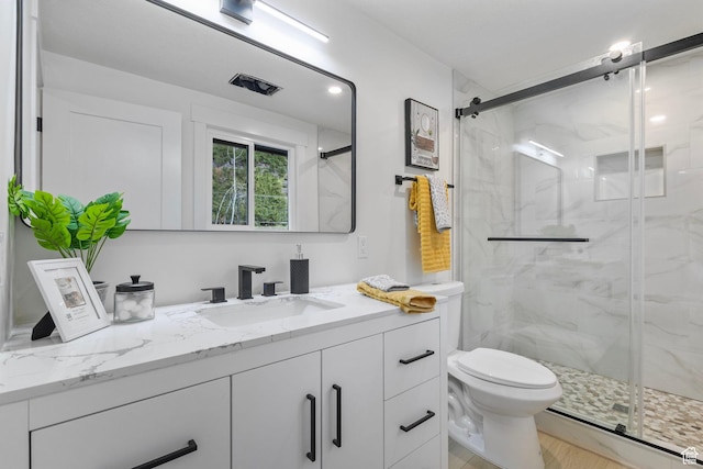 2605 E Portsmouth Ave S, Cottonwood Heights, UT 84121 - bathroom with a marble finish shower, toilet, and vanity