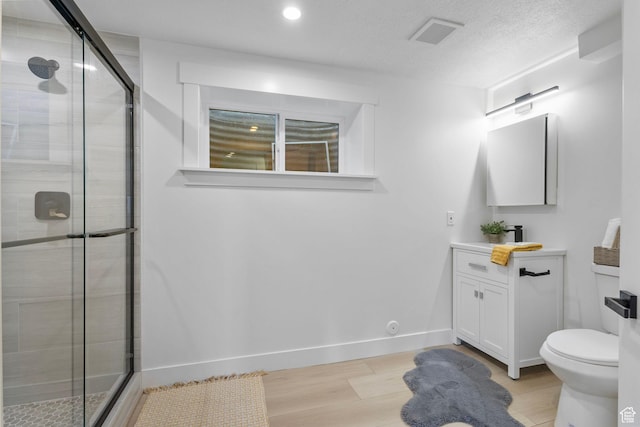 2605 E Portsmouth Ave S, Cottonwood Heights, UT 84121 - bathroom with vanity, toilet, baseboards, and a stall shower