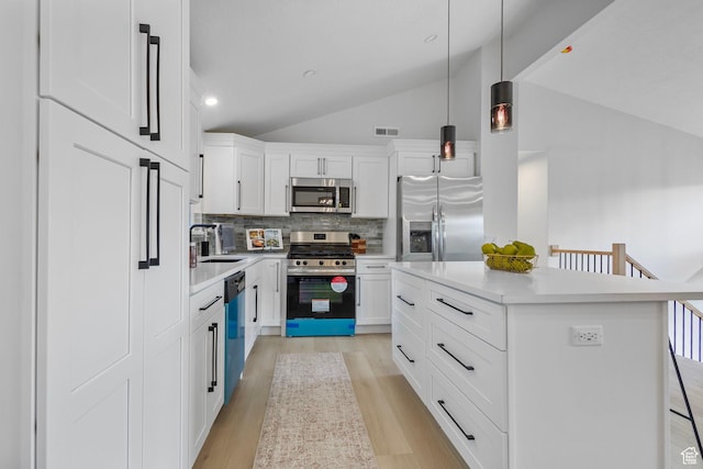 2605 E Portsmouth Ave S, Cottonwood Heights, UT 84121 - kitchen with visible vents, light wood finished floors, a sink, vaulted ceiling, and appliances with stainless steel finishes