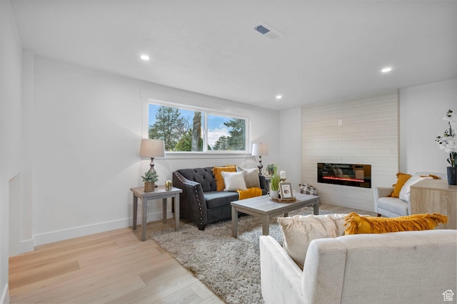 2605 E Portsmouth Ave S, Cottonwood Heights, UT 84121 - living room featuring light wood-type flooring, visible vents, recessed lighting, a large fireplace, and baseboards