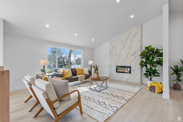 2605 E Portsmouth Ave S, Cottonwood Heights, UT 84121 - living area featuring recessed lighting, a premium fireplace, wood finished floors, and vaulted ceiling