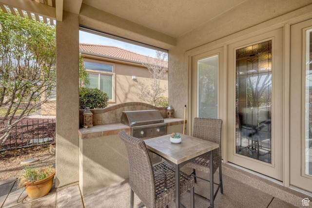 view of patio / terrace with a grill and outdoor dining space