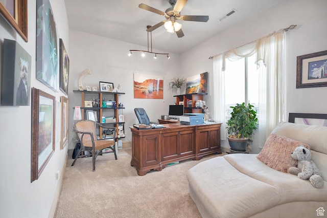 office area featuring visible vents, light carpet, and ceiling fan