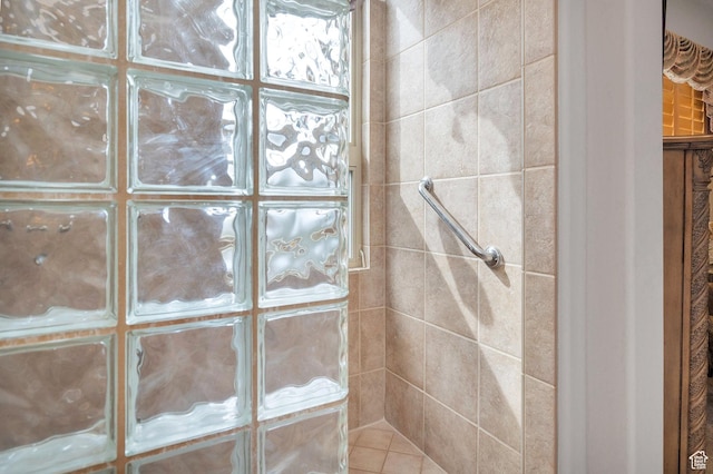 full bathroom with tiled shower