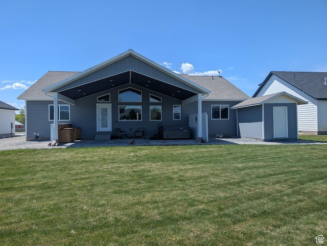 1060 N 100 E, Preston, ID 83263 - back of house with a patio, a storage shed, a yard, an outdoor structure, and a jacuzzi