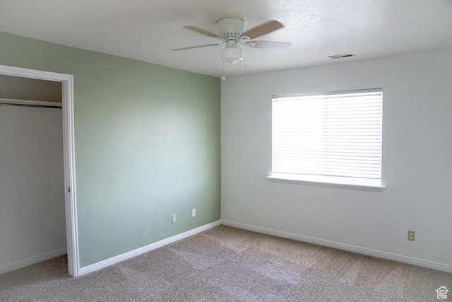 8084 N N Ridge Loop Unit F12, Eagle Mountain, UT 84005 - unfurnished bedroom with a ceiling fan, carpet flooring, baseboards, and visible vents