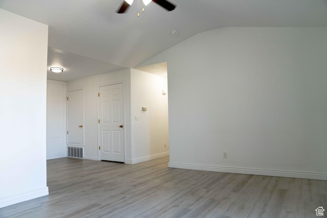 8084 N N Ridge Loop Unit F12, Eagle Mountain, UT 84005 - unfurnished room featuring baseboards, visible vents, lofted ceiling, ceiling fan, and light wood-type flooring