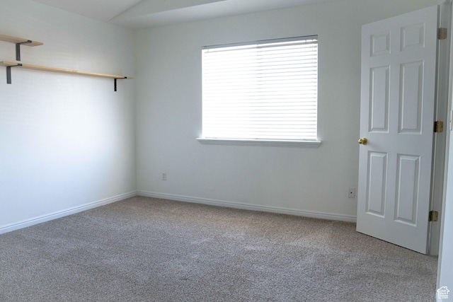 8084 N N Ridge Loop Unit F12, Eagle Mountain, UT 84005 - carpeted empty room with a wealth of natural light and baseboards