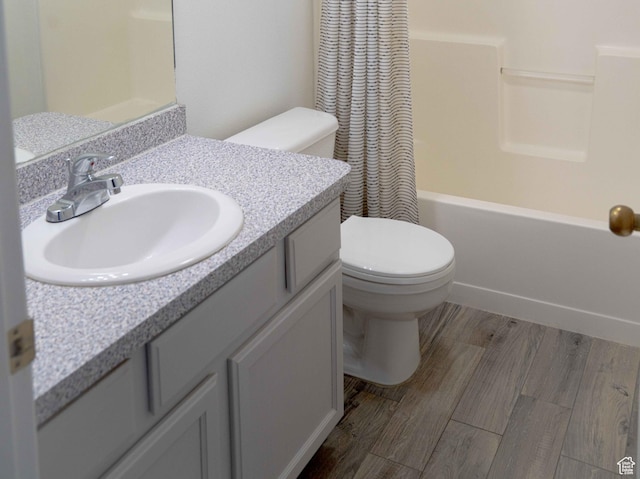 8084 N N Ridge Loop Unit F12, Eagle Mountain, UT 84005 - bathroom with shower / bath combination with curtain, toilet, vanity, and wood finished floors