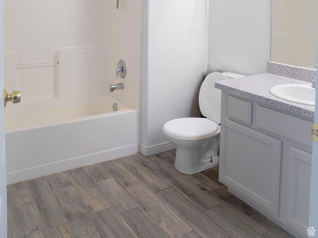 8084 N N Ridge Loop Unit F12, Eagle Mountain, UT 84005 - full bath with shower / bathing tub combination, toilet, wood finished floors, and vanity