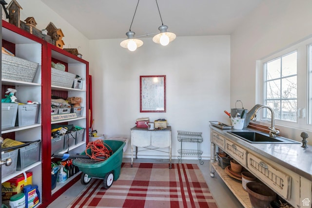 kitchen with decorative light fixtures and a sink