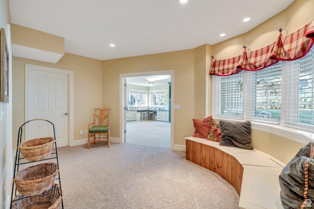 sitting room with recessed lighting, baseboards, and carpet floors