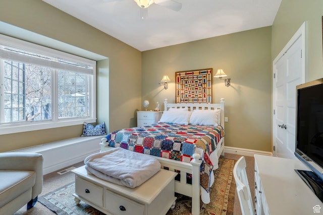 bedroom featuring baseboards and ceiling fan