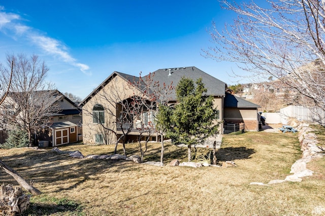 2652 E 6500 S, Uintah, UT 84403 - rear view of house featuring a storage shed and an outbuilding