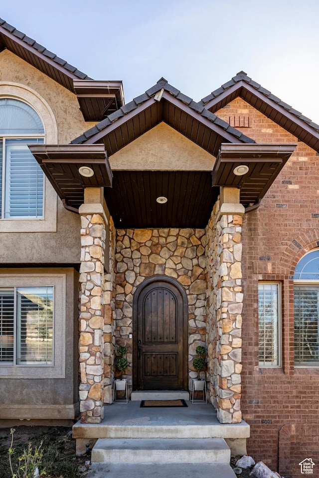 2652 E 6500 S, Uintah, UT 84403 - view of exterior entry with stucco siding, stone siding, and brick siding